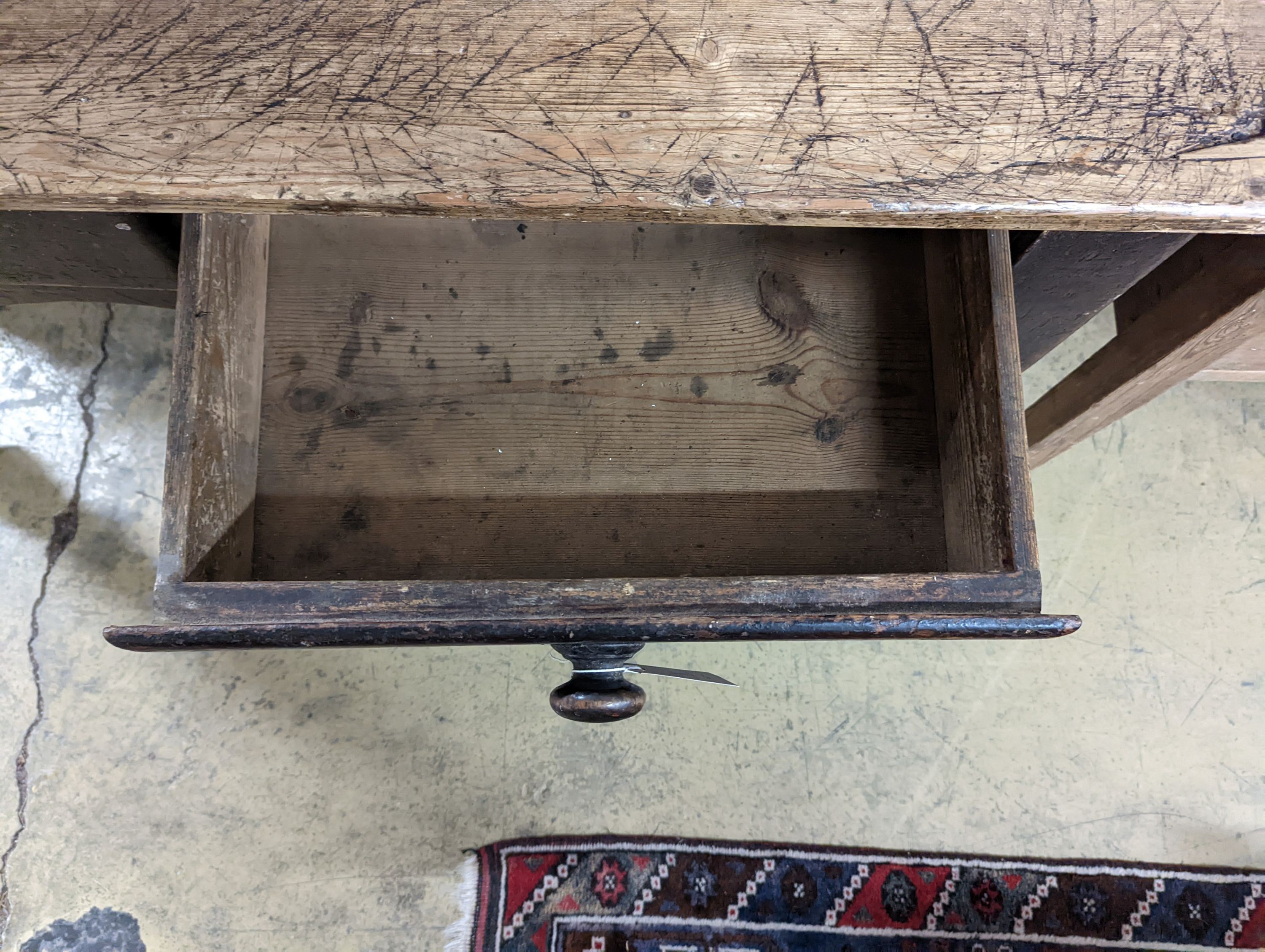 A Victorian pine two drawer kitchen table. W-133cm, D-66cm, H-73cm.